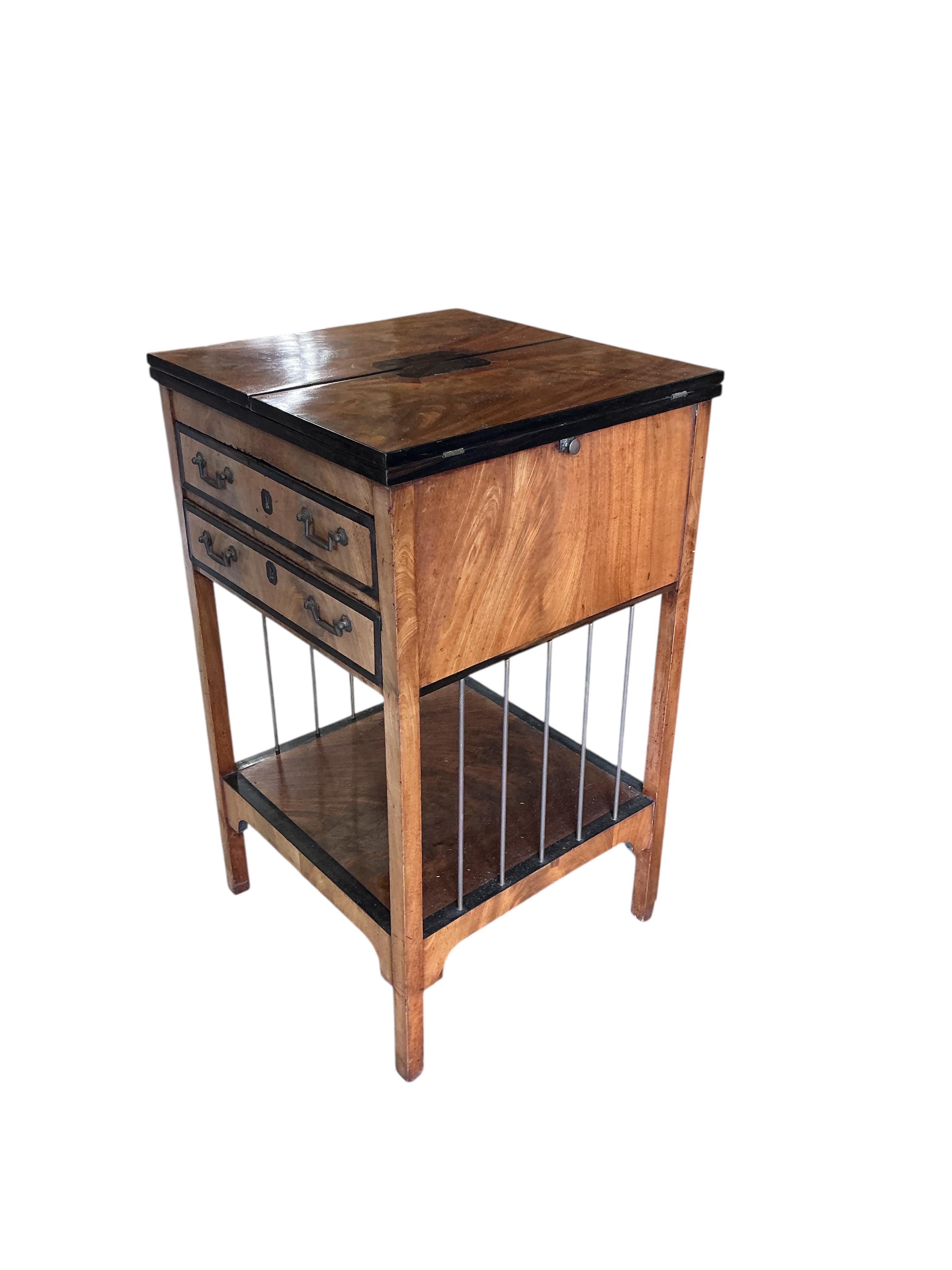 A George III ebony banded mahogany two drawer writing table, with leather lined twin flap top, width 48cm, depth 47cm, height 81cm